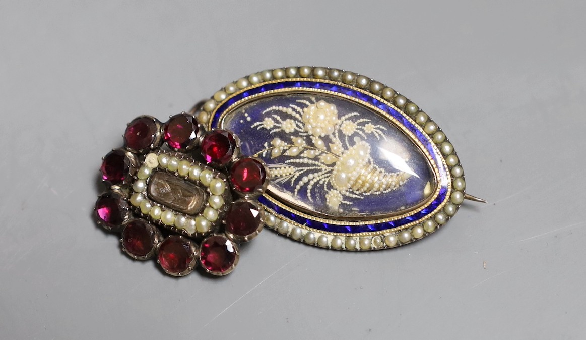 A Victorian yellow metal, garnet and seed pearl set mourning brooch, with plaited hair below a glazed panel, 24mm and a similar navette shaped yellow metal, enamel and seed pearl pendant brooch.